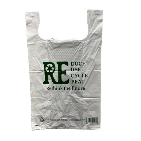 Large White plastic singlet bag with recycling message on a white background