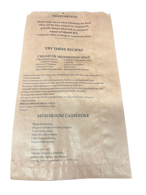 Kraft paper mushroom bag with recipe text on a white background