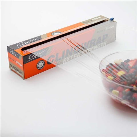 Box of Capri clear cling wrap with a bowl of fruit on a white background