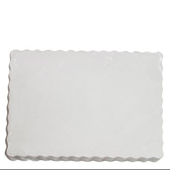 Rectangular paper placemats with scalloped edge on a white background