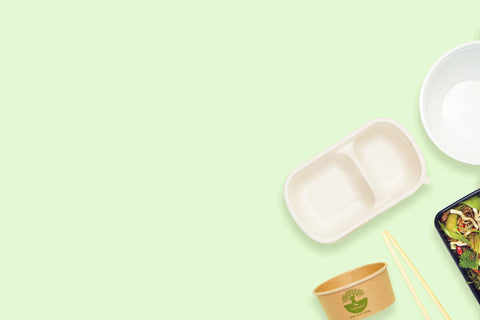 A variety of Food packaging containers on a green background