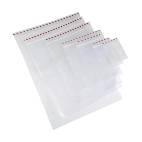 Set of clear ziplock bags with red sealing lines on a white background