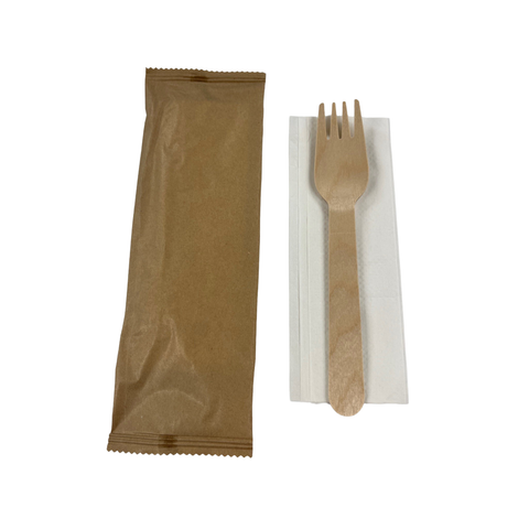 Fork + napkin set in s Brown paper bag on a white background