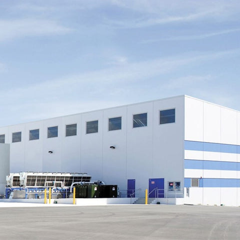 Bonson manufacturing plant Large industrial building with a blue sky background